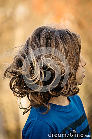 Boy with long hair Stock Photo