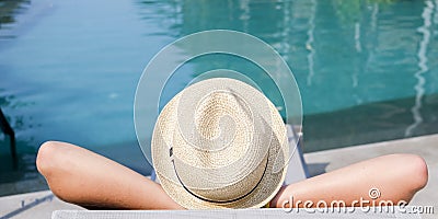 Boy on the longue chair near the swimming pool relaxing. Travel concept, travelling, hotel business Stock Photo