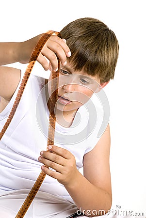 Boy looked at celluloid Stock Photo