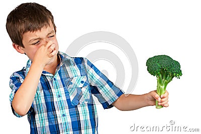 Boy Looking at Broccoli with Disgust Stock Photo