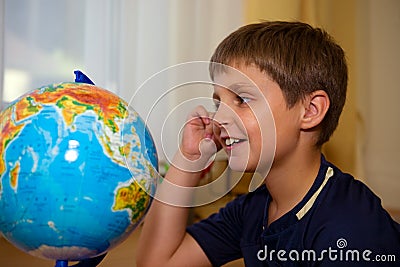 Boy looking globe Stock Photo