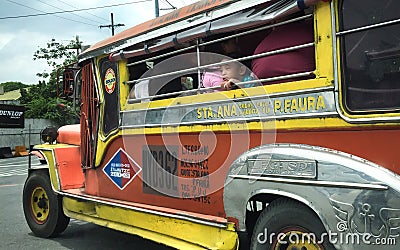 Boy looking out of Jeepney. Editorial Stock Photo
