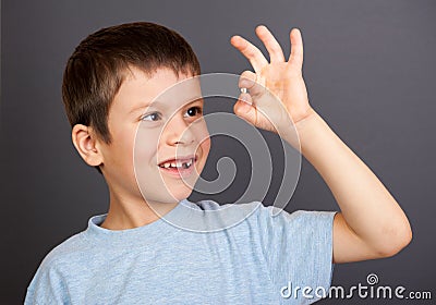 Boy looks at lost tooth Stock Photo