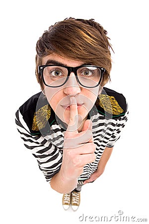 Boy Making Silence Gesture Stock Photo