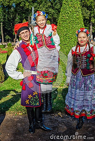 He boy member of the Polish folk dance GAIK holding the girl in hands. Editorial Stock Photo