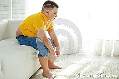 A boy with metabolic disorders. Child with the problem of childhood obesity. Overweight obese fat boy. Stock Photo