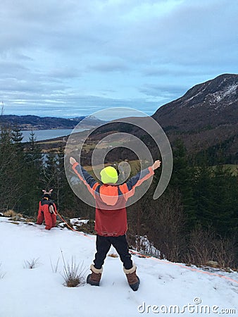 Boy on Mountain hikking with his dog Stock Photo