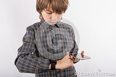 Boy pairing his smart watch with a smartphone Stock Photo