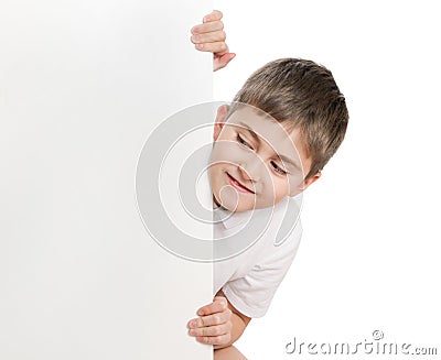 Boy peep out through poster Stock Photo