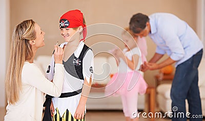 Boy, pirate costume and halloween with mother in home, face paint and happiness in childhood. Son, smile and house Stock Photo