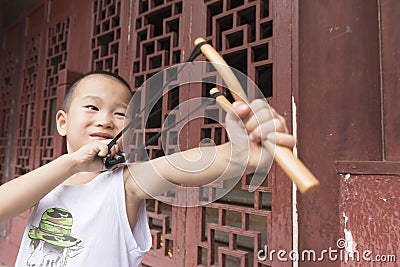 Boy play catapult Stock Photo