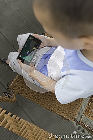 Boy play smartphone Stock Photo