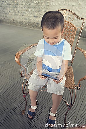 Boy play smartphone Stock Photo