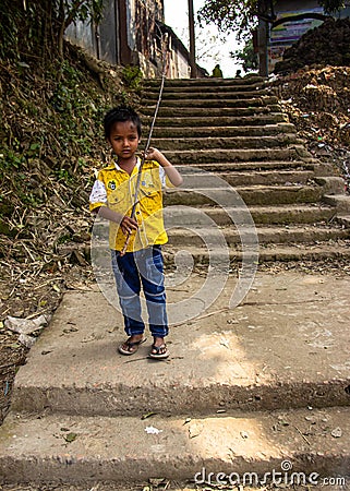 A boy playing alone on the stairways. Editorial Stock Photo