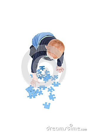 Boy playing blank puzzle game Stock Photo