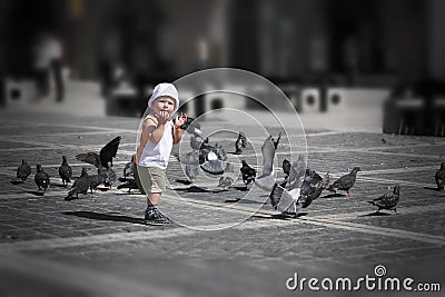 Boy playing in city center Stock Photo