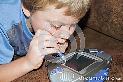 Boy Playing a Computer Game Stock Photo