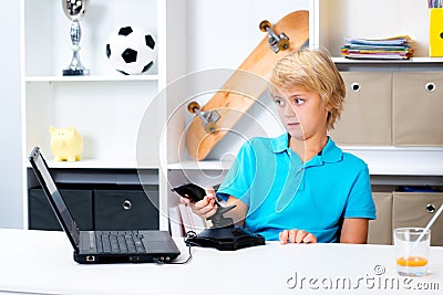 Boy is playing computer game Stock Photo