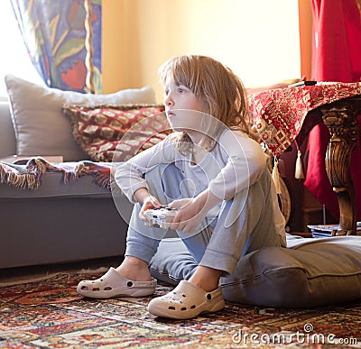 Boy Playing Console Game Stock Photo