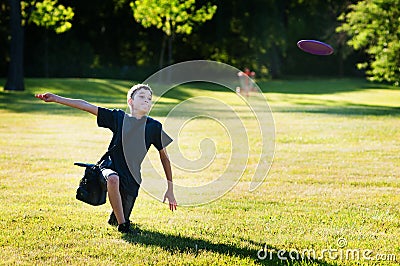 Boy playing disc golf Stock Photo