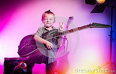 Boy playing guitar , kid guitarist . Stock Photo