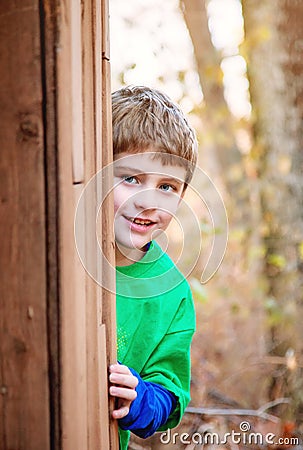 Boy playing hide and seek Stock Photo