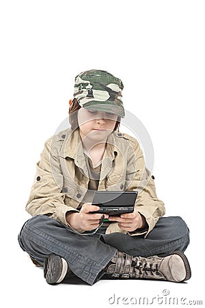 Boy playing with his gadget Stock Photo