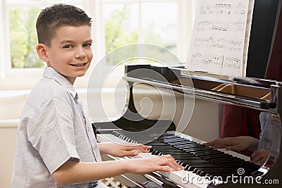 Boy Playing Piano Stock Photo