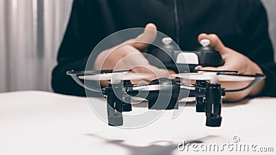 Boy Playing With A Small Quadrocopter Drone Close-up. Stock Photo