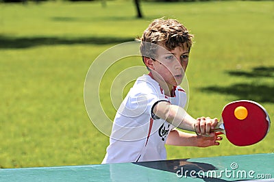 Boy playing table tennis Stock Photo