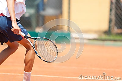 Boy playing tennis. Detail. Large copy. Stock Photo