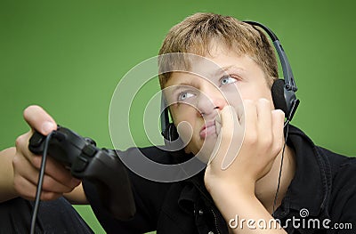 Boy Playing Video Games - BORED TIRED Stock Photo