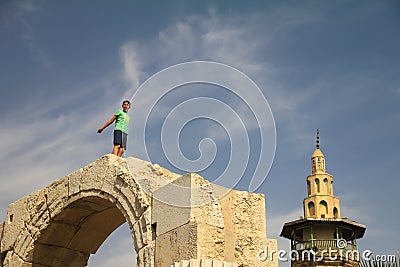 The boy is playing on the walls of Damascus. Editorial Stock Photo