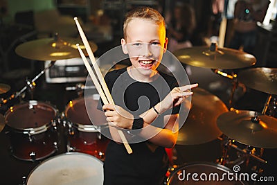 Boy plays drums in recording studio Stock Photo