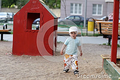 Boy plays in playground Stock Photo