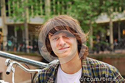 Boy portrait, 16 years old teenager with long hair Stock Photo