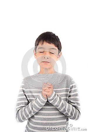 Boy praying meditating on white background Stock Photo