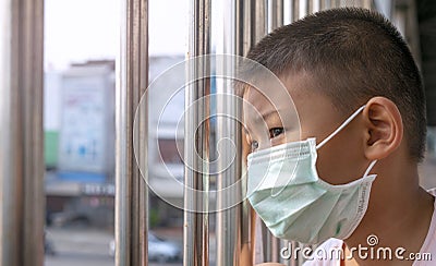 Portrait of Cute Boy wearing surgical mask. Stock Photo