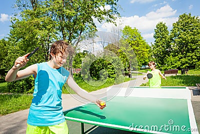 Boy with racket ready to play in table tennis Stock Photo