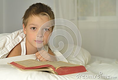 Boy is reading Bible Stock Photo