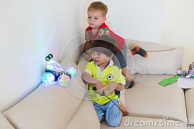 Boy received a gift of a car robot. The envy of the other. Stock Photo