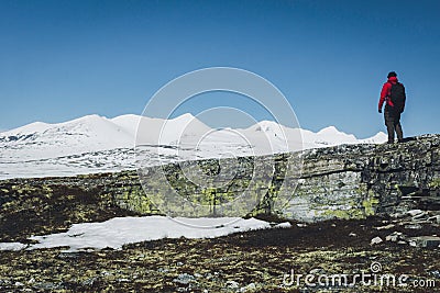 Boy with red jacket enjoy the view with snow Stock Photo