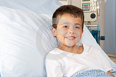 Boy Relaxing In Hospital Bed Stock Photo