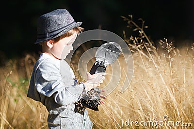 Boy with retro camera Stock Photo