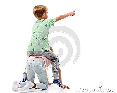 A boy rides a girl like a horse. Stock Photo