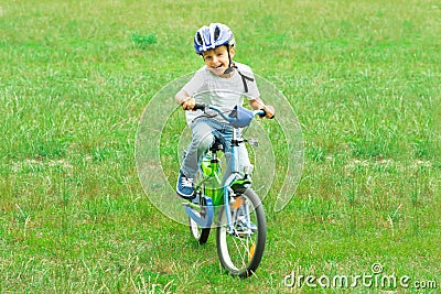 Boy Riding Bicycle Stock Photo