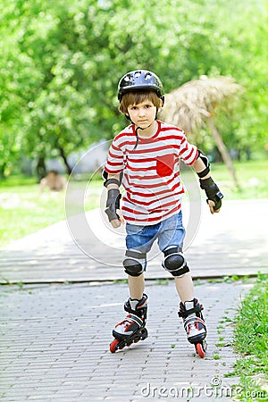 Boy is riding on rollers Stock Photo
