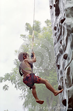 Boy Rock Climbing, Jakarta Indonesia Stock Photo