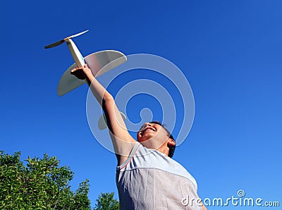 Boy running airplane model Stock Photo