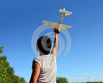 Boy running airplane model Stock Photo